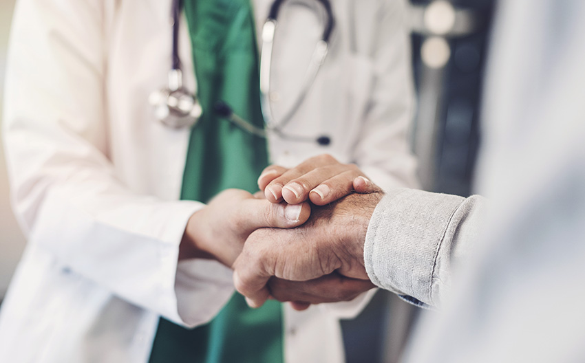 Doctor and patient shaking hands